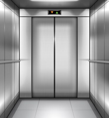 Empty elevator cabin with closed doors inside انتخاب انواع کابین آسانسور